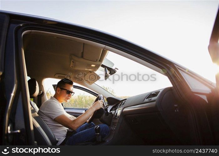 young man sitting car