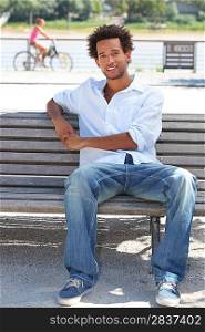 young man sitting on a bench