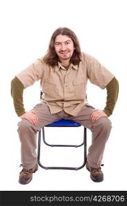 Young man sitting on a chair, isolated over white