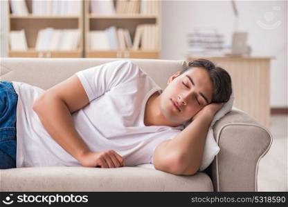 Young man sleeping in sofa couch