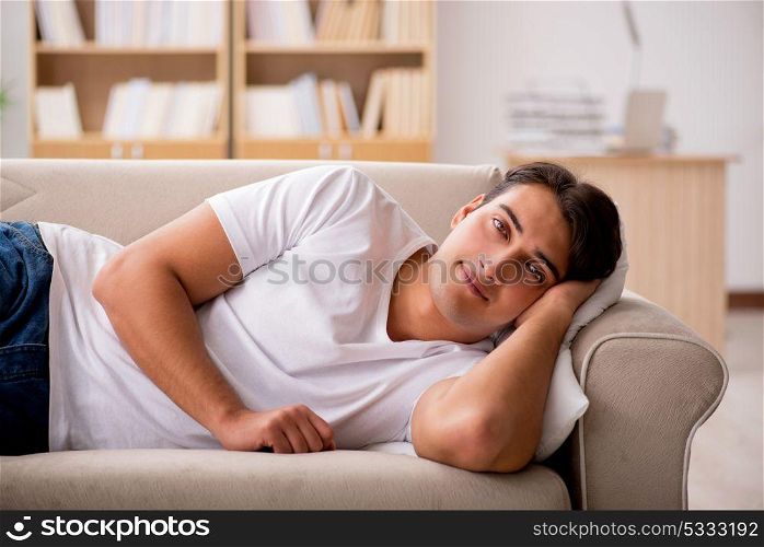 Young man sleeping in sofa couch
