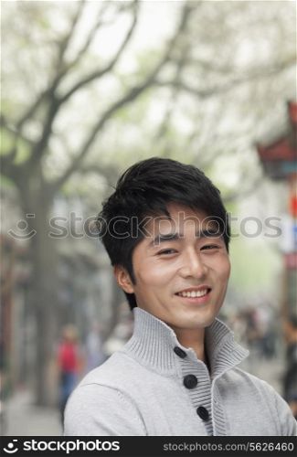 Young Man smiling and looking at camera