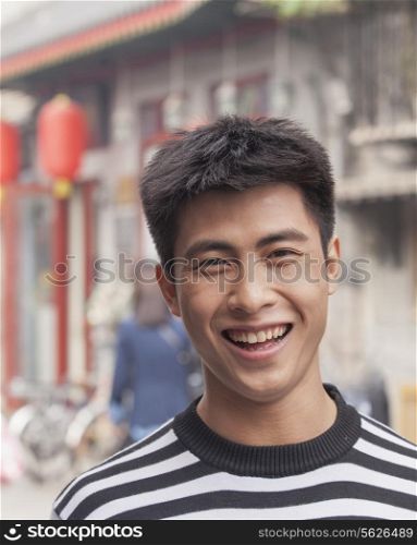 Young Man smiling looking at camera