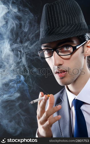 Young man smoking cigarette