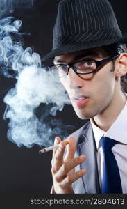 Young man smoking cigarette