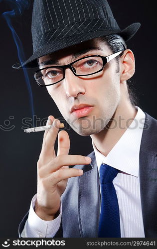 Young man smoking cigarette