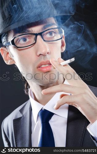 Young man smoking cigarette