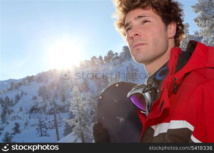 young man snowboarding