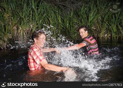 Young Man Splashing Each Other