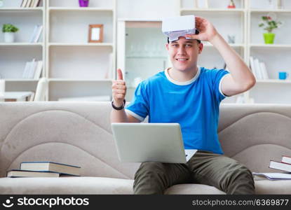 Young man student studying with virtual glasses