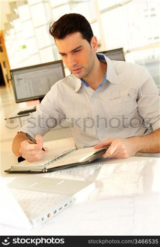 Young man studying at university