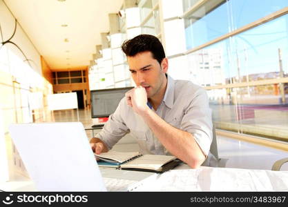 Young man studying at university