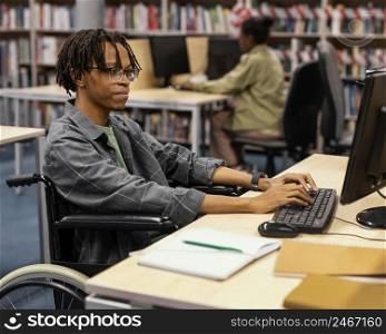 young man studying university library 4