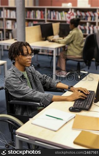 young man studying university library 5