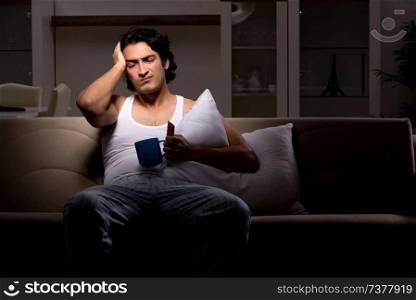 Young man suffering at home night time 