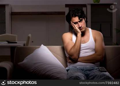 Young man suffering at home night time 