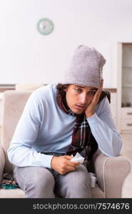 Young man suffering from flu at the home. Young man suffering from flu at home