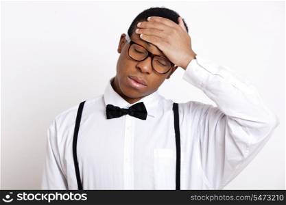 Young man suffering from headache over white background