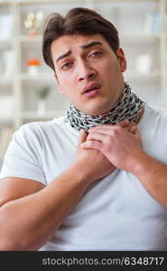 Young man suffering from sore throat