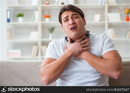 Young man suffering from sore throat. The young man suffering from sore throat