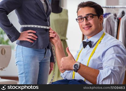 Young man tailor working with female client