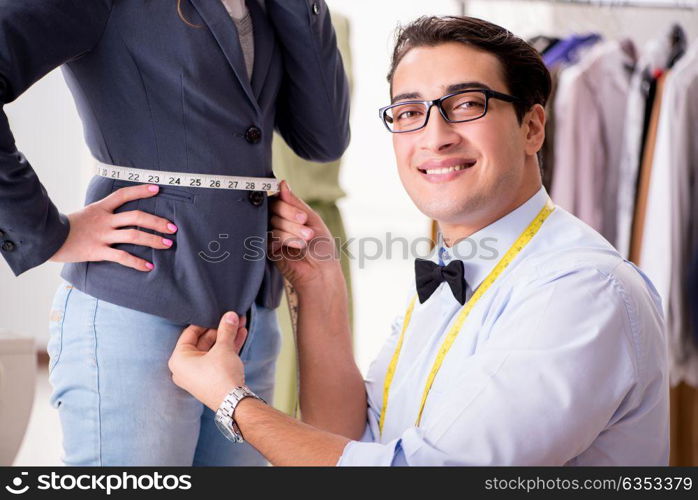 Young man tailor working with female client