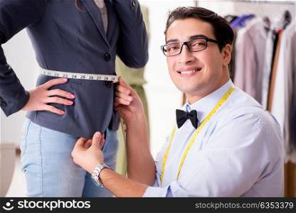 Young man tailor working with female client