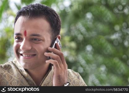 Young man talking on a mobile phone