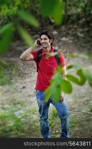Young man talking on mobile phone and looking away