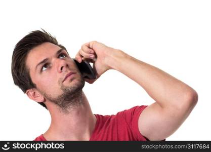 Young Man talking on the phone and looking up