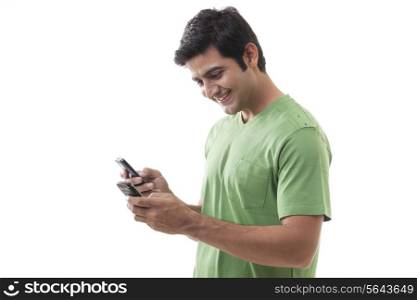 Young man texting over white background