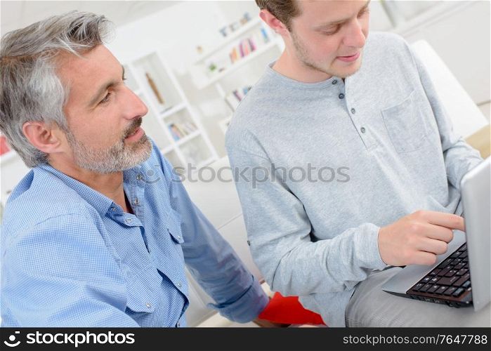 young man typing on the laptop