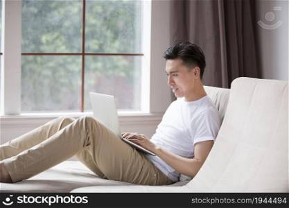 Young man using a laptop computer
