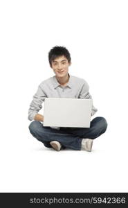 Young man using a laptop computer