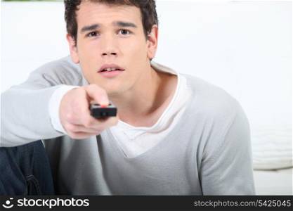 young man using a remote controller