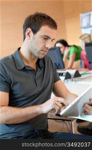 Young man using tablet in office
