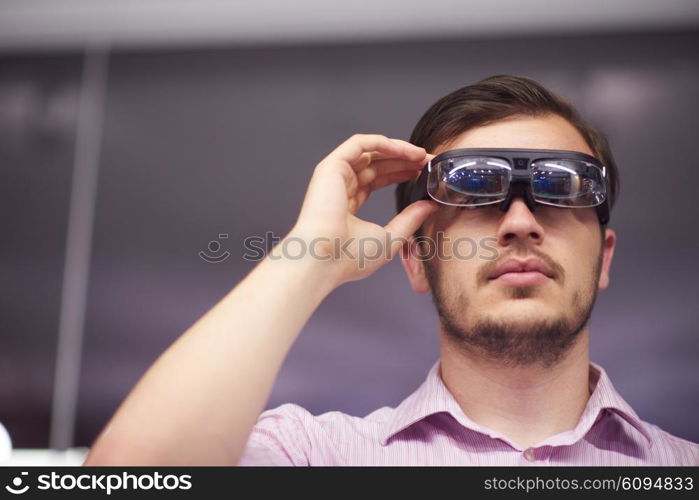 young man using virtual reality gadget computer technology glasses