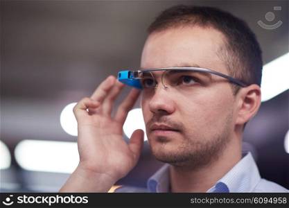 young man using virtual reality gadget computer technology glasses