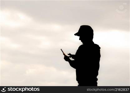 Young man viewing mobile phone. Swipe gesture on phones screen