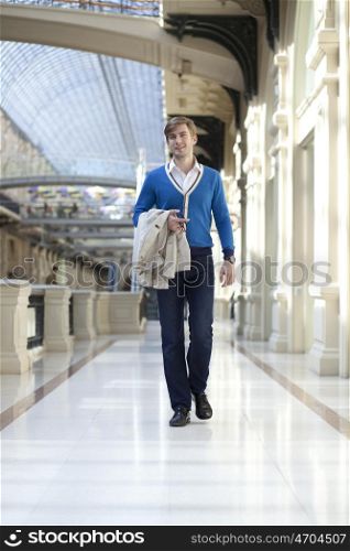 Young man walking in the store