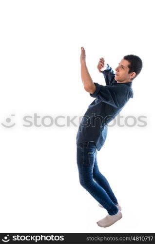 young man wearing blue shirt flinched his arms scared against white background