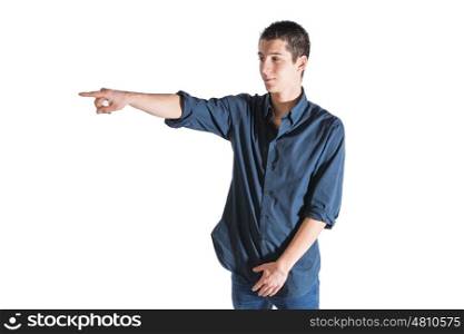 young man wearing blue shirt pointing against white background