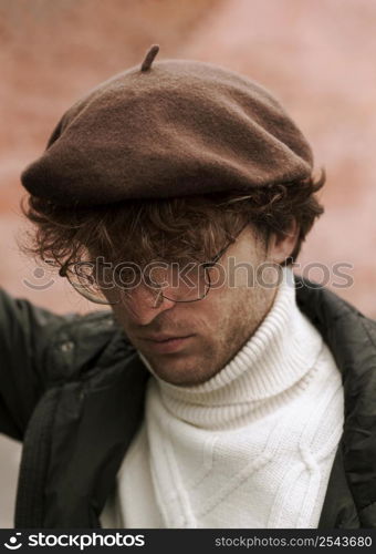 young man wearing french hat