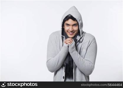Young man wearing jacket feeling cold