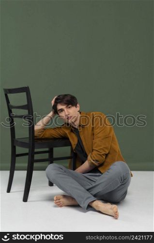 young man wearing shirt posing chair 5