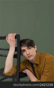 young man wearing shirt posing chair 8