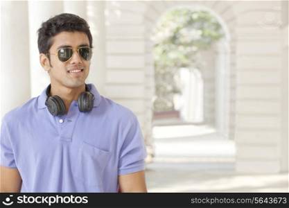 Young man wearing sunglasses looking away