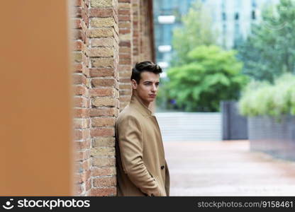 Young man wearing winter clothes in the street.