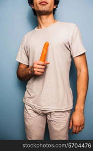 Young man with a carrot