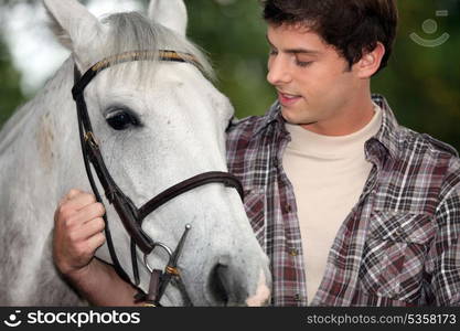 Young man with a horse